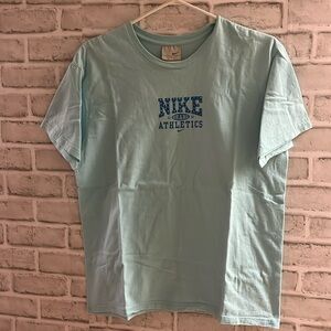 Nike Athletics short sleeves t-shirt size 12-14, baby blue with logo sparkle